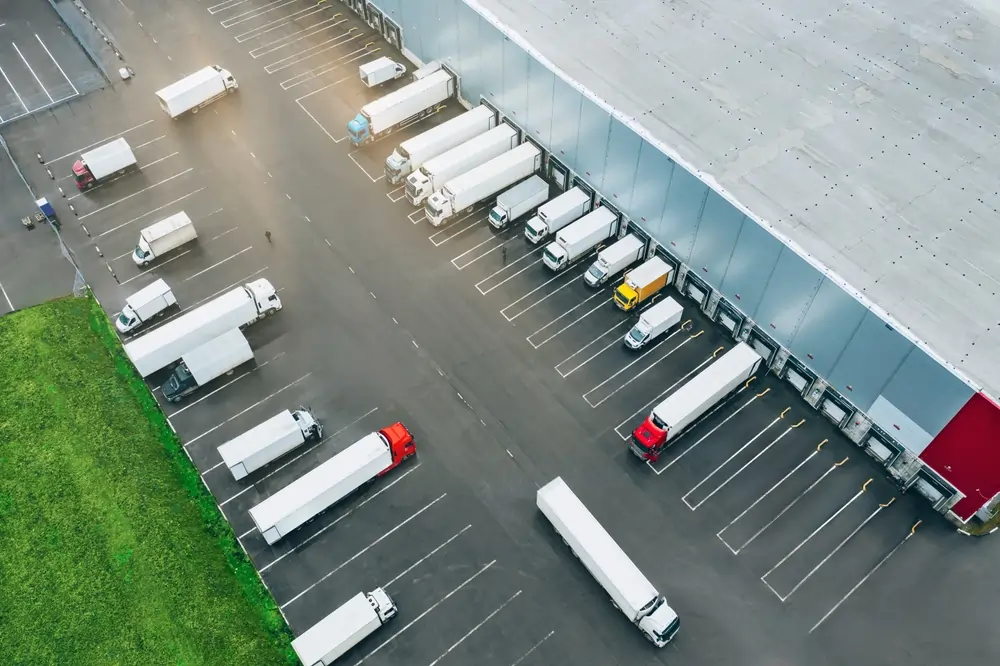 Transport trucks being loaded at a warehouse